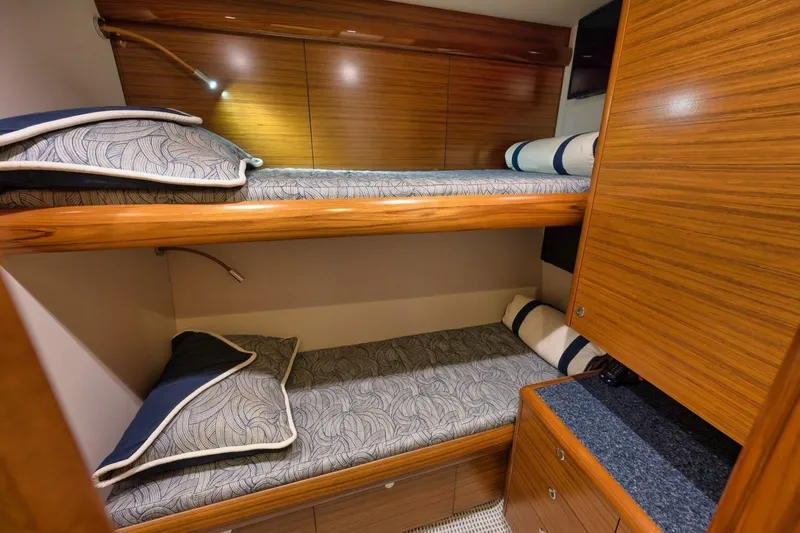 Slide: The Image of Luxurious Weaver custom 2012 yacht cabin with wooden bunk beds and elegant bedding. - 27