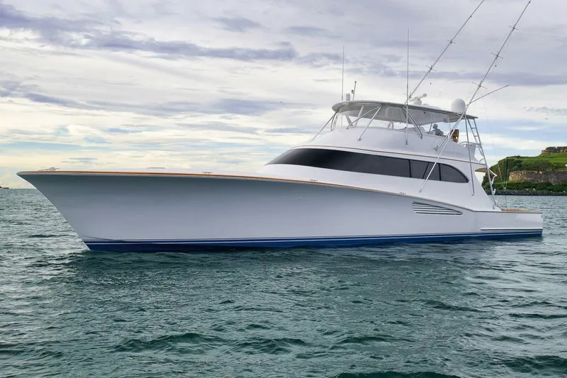Slide: The Image of Luxury Weaver custom yacht on the water, 2012 model, under a cloudy sky. - 4