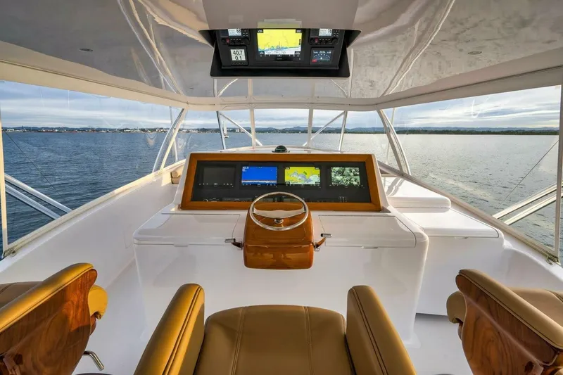 Slide: The Image of Luxurious Weaver custom yacht helm with advanced navigation systems, 2012 model, overlooking serene waters. - 40