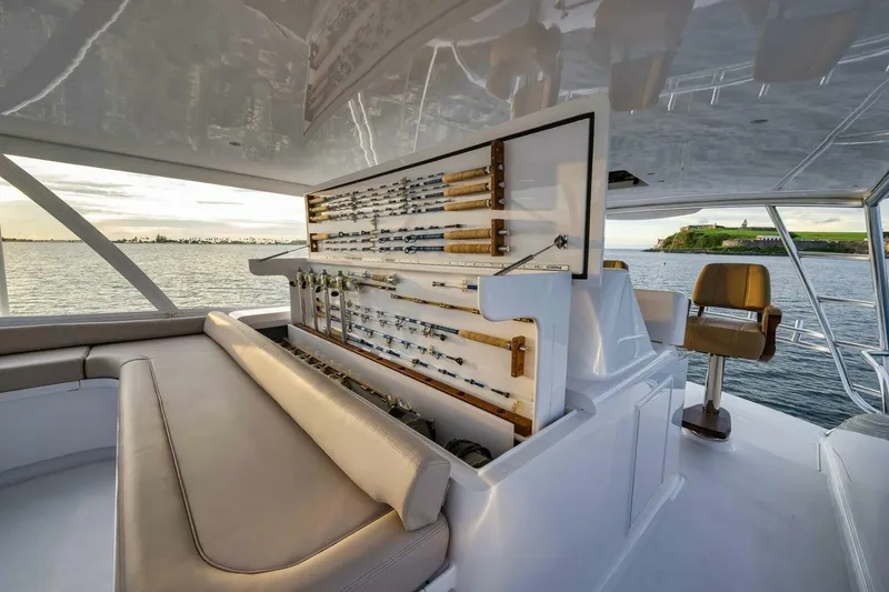 Slide: The Image of Luxurious Weaver custom yacht interior with fishing rod storage, overlooking serene ocean view, 2012 model. - 44