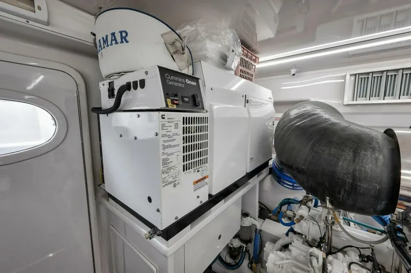 Slide: The Image of Cummins Onan generator in a 2012 Weaver custom boat engine room. - 48