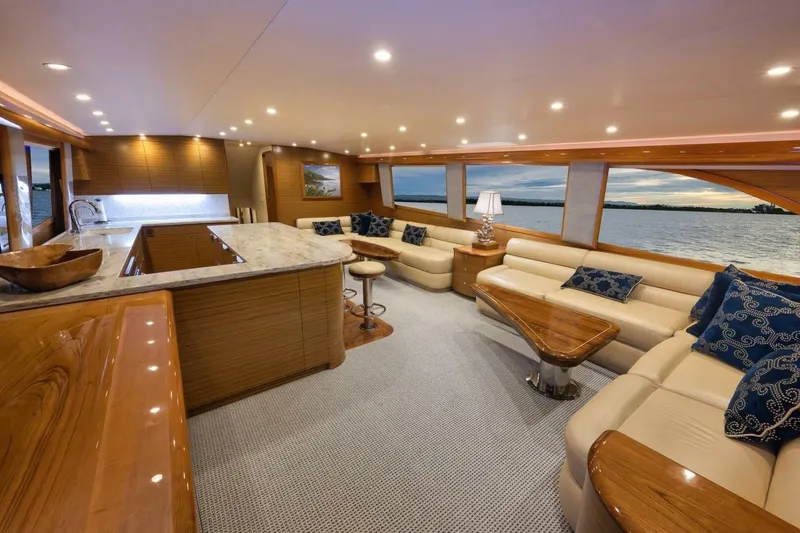 Slide: The Image of Luxurious Weaver custom yacht interior, 2012 model, featuring elegant seating and panoramic water views. - 8