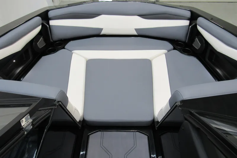 Slide: The Image of 2026 Axis A200 boat interior with gray and white cushioned seating. - 11