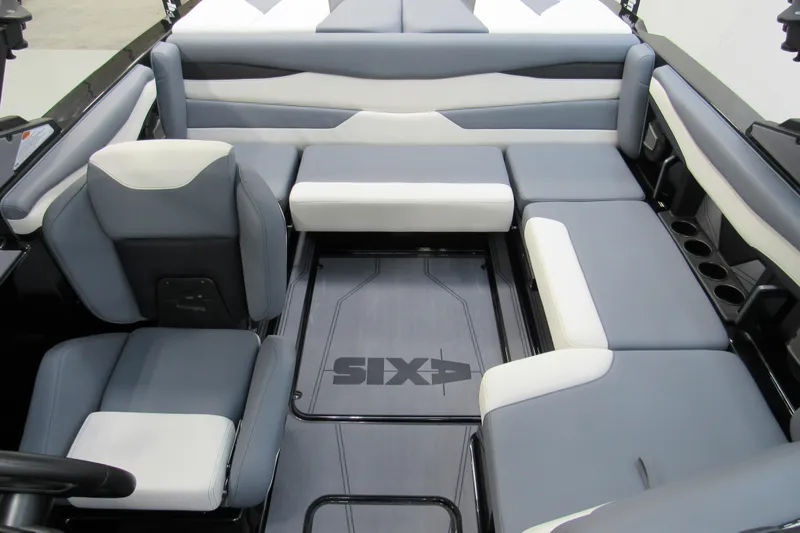 Slide: The Image of 2026 Axis A200 boat interior with gray and white seating, featuring cup holders and sleek design. - 12