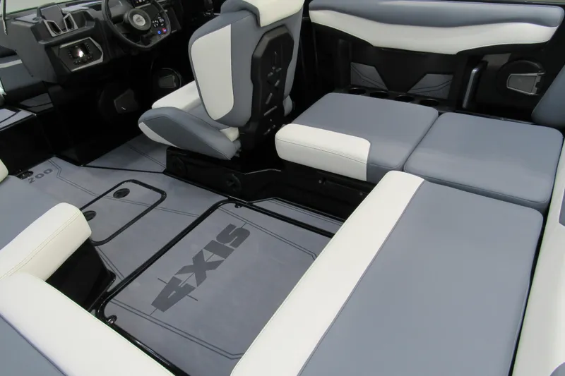 Slide: The Image of 2026 Axis A200 boat interior with gray and white seating and modern dashboard. - 5