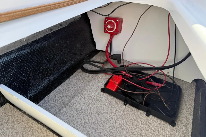 Slide: The Image of Interior view of 2026 Stingray 191 DC boat showing wiring and battery compartment. - 11