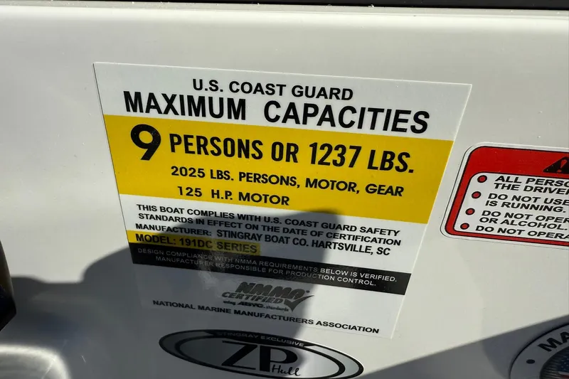 Slide: The Image of Stingray 191 DC 2026 boat capacity label, 9 persons or 1237 lbs, 125 HP motor. - 16