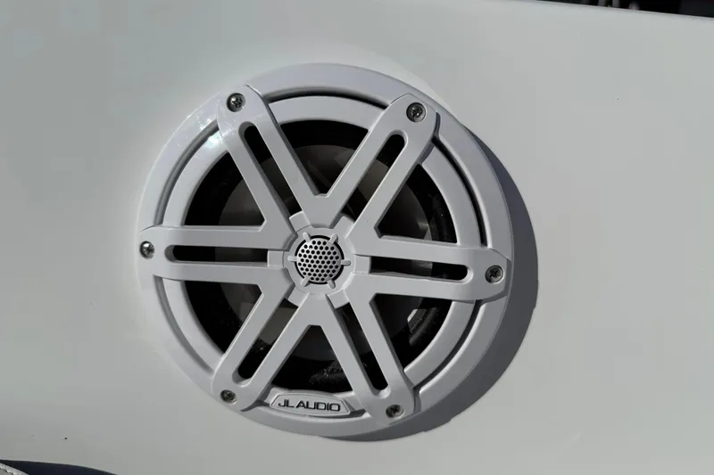 Slide: The Image of White JL Audio speaker on 2026 Stingray 191 DC boat. - 19