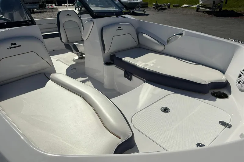 Slide: The Image of 2026 Stingray 191 DC boat interior with white seating and modern design. - 7
