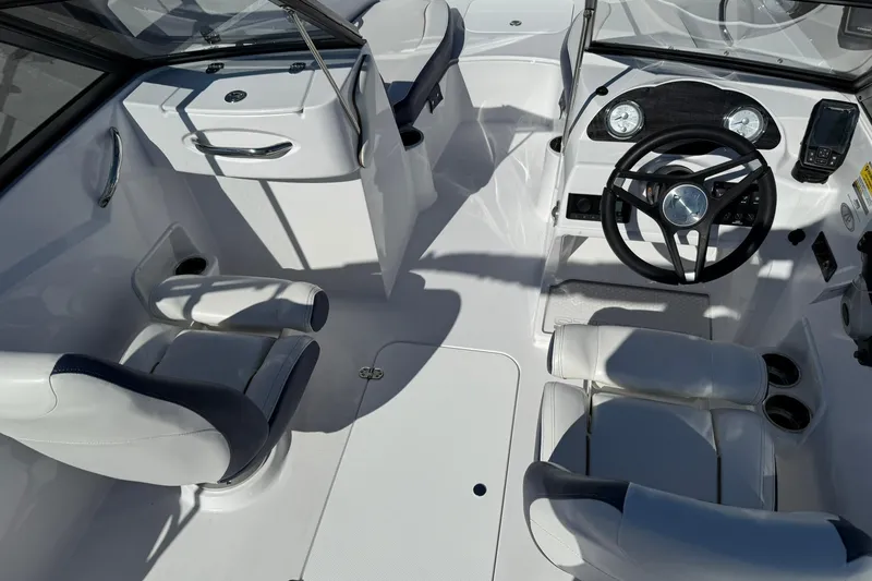 Slide: The Image of 2026 Stingray 191 DC boat interior with modern steering and seating arrangement. - 9