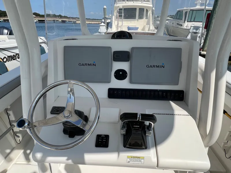 Slide: The Image of Helm of 2013 Jupiter 30 FS boat with Garmin navigation displays. - 10