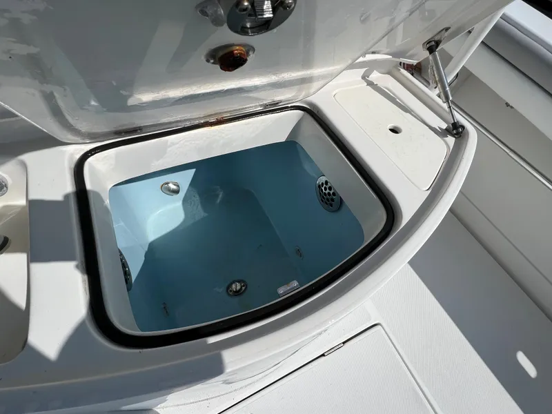 Slide: The Image of Open storage compartment on a 2013 Jupiter 30 FS boat, showcasing interior details. - 19