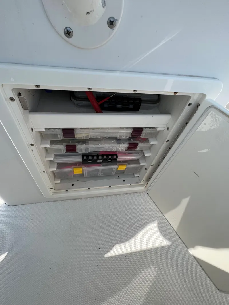 Slide: The Image of Electrical panel inside a 2013 Jupiter 30 FS boat, featuring organized wiring and components. - 22