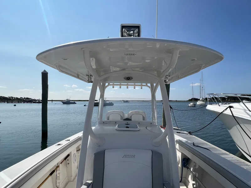 Slide: The Image of 2013 Jupiter 30 FS boat on calm water under clear blue sky. - 29