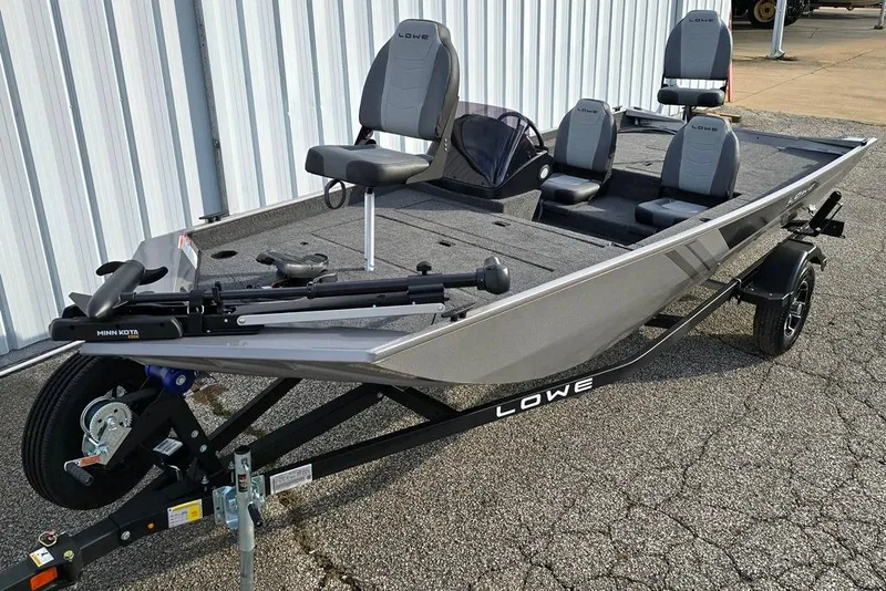 The Image of 2026 Lowe Skorpion 17 fishing boat with Minn Kota trolling motor, parked on a trailer. - 0