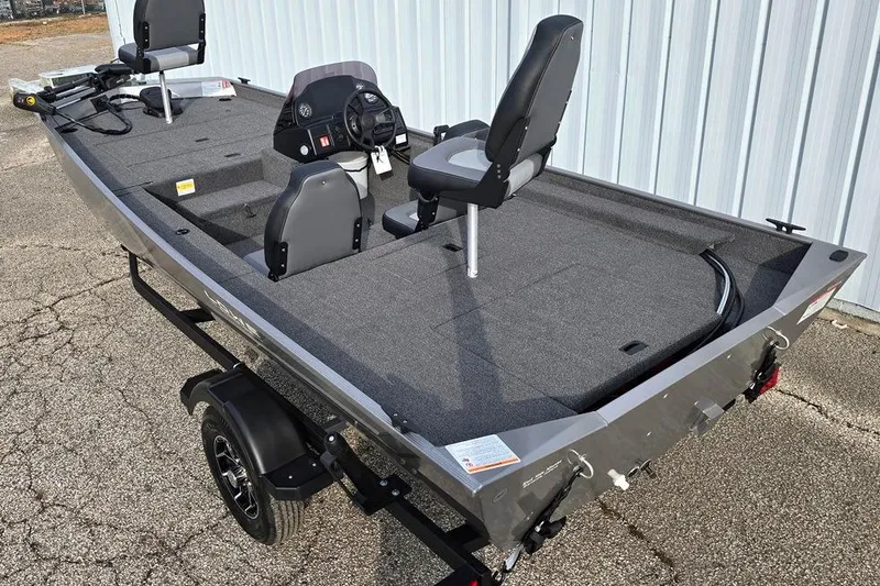 Slide: The Image of 2026 Lowe Skorpion 17 boat with Mercury 50 engine, parked on a trailer. - 2