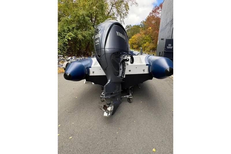Slide: The Image of Ribcraft 7.8 boat with Yamaha 300 V6 engine, 2019 model, parked outdoors. - 7