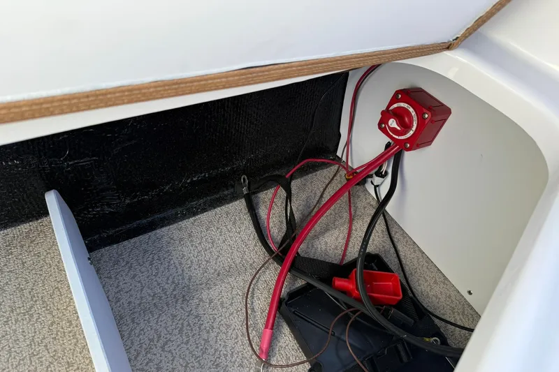 Slide: The Image of Electrical wiring and switch inside a 2026 Stingray 191 DC boat compartment. - 11
