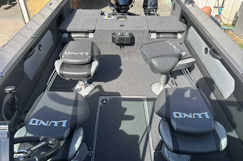 Slide: The Image of Interior of 2021 Lund 1975 Tyee boat with four cushioned seats. - 7