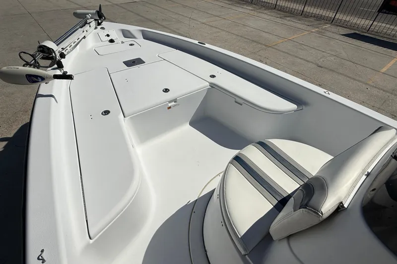 Slide: The Image of 2007 Champion 22 Bay Champ boat interior with seating and storage compartments. - 10
