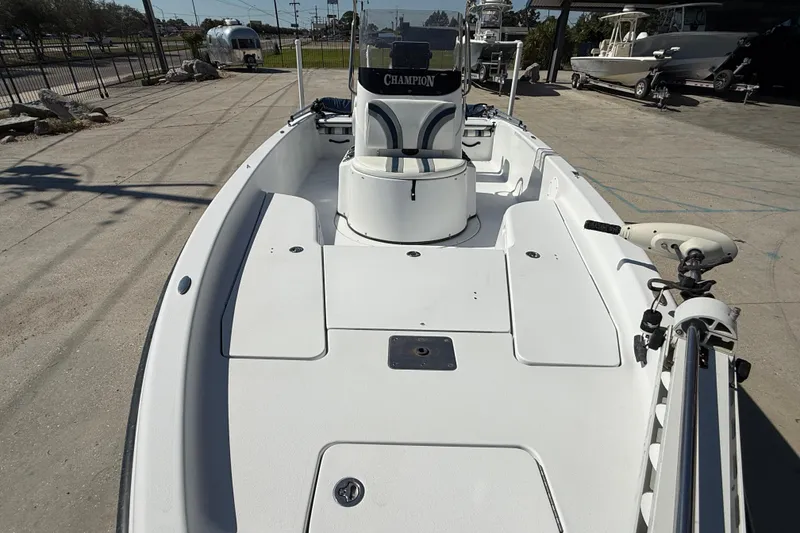 Slide: The Image of 2007 Champion 22 Bay Champ boat with spacious deck and modern design. - 11