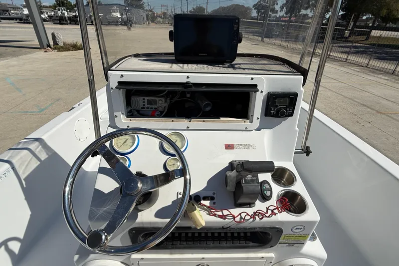 Slide: The Image of 2007 Champion 22 Bay Champ boat console with steering wheel and navigation equipment. - 14