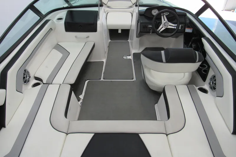 Slide: The Image of 2017 Yamaha Boats AR195 interior with sleek seating and modern dashboard design. - 4