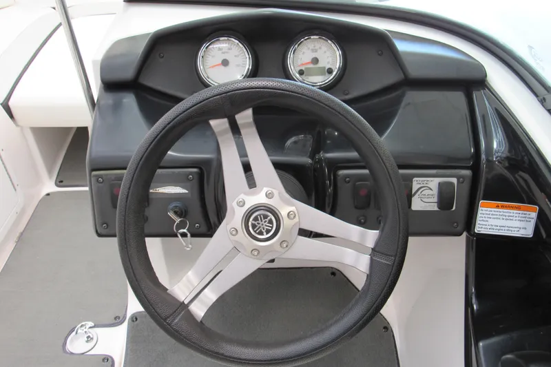 Slide: The Image of 2017 Yamaha Boats AR195 dashboard with steering wheel and gauges. - 8