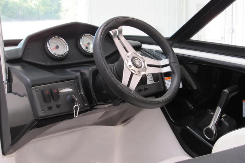 Slide: The Image of 2017 Yamaha Boats AR195 dashboard with steering wheel and gauges. - 9