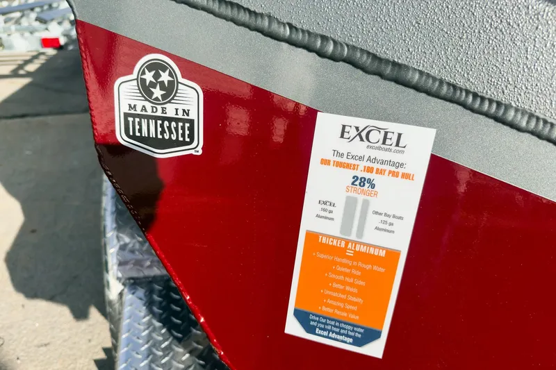 Slide: The Image of 2026 Excel Bay Pro Elite 220 boat, "Made in Tennessee" sticker, highlighting durability and aluminum strength. - 22