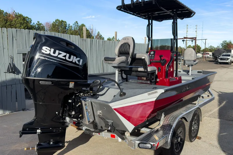 Slide: The Image of 2026 Excel Bay Pro Elite 220 boat with Suzuki outboard motor on trailer. - 28