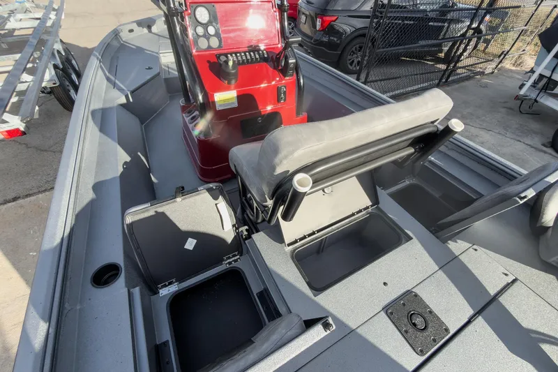 Slide: The Image of 2026 Excel Bay Pro Elite 220 boat interior with seating and storage compartments. - 8