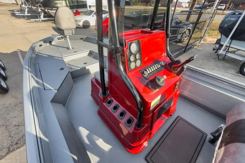 Slide: The Image of 2026 Excel Bay Pro Elite 220 boat with red console and modern controls. - 9
