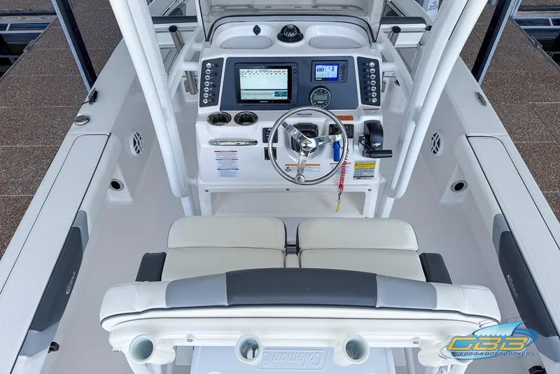 Slide: The Image of 2023 Robalo 226 Cayman boat cockpit with modern controls and seating. - 15