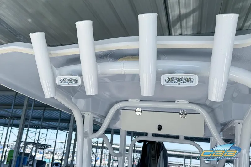 Slide: The Image of 2023 Robalo 226 Cayman boat T-top with rod holders and LED lights. - 25