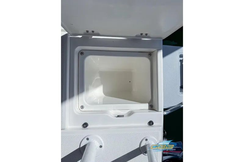 Slide: The Image of Open storage compartment on 2023 Robalo 226 Cayman boat. - 28