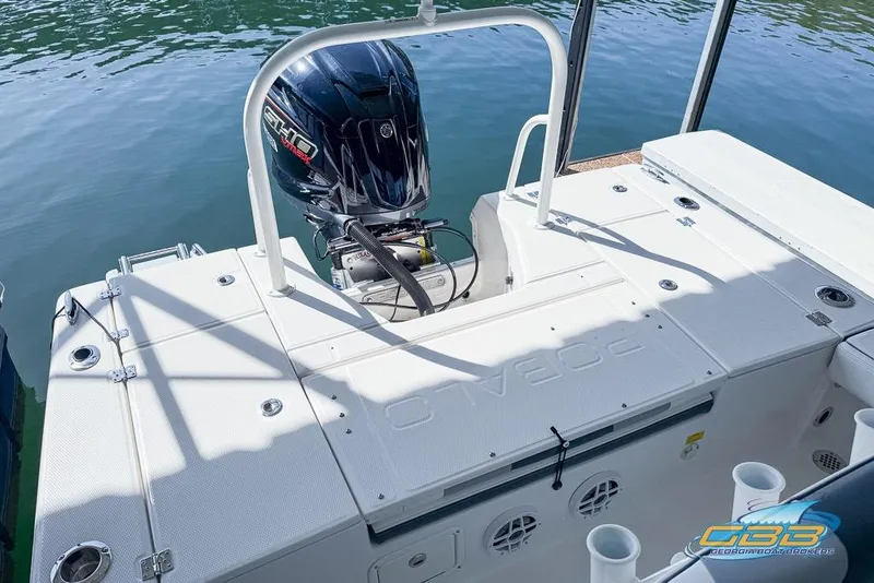 Slide: The Image of 2023 Robalo 226 Cayman boat with Yamaha outboard engine on calm water. - 29