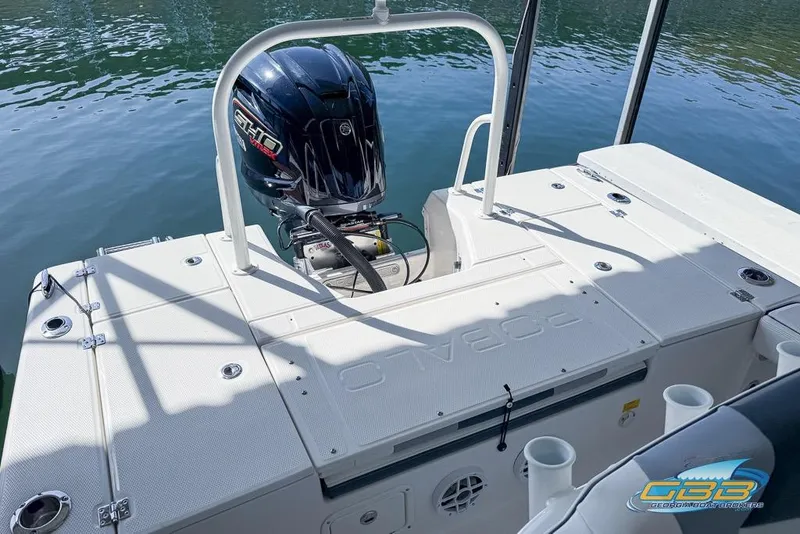 Slide: The Image of 2023 Robalo 226 Cayman boat with Yamaha engine on calm water. - 31