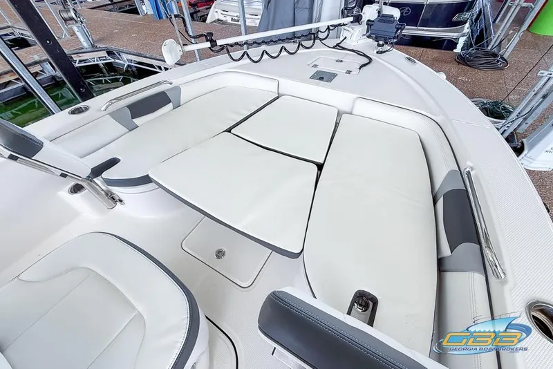 Slide: The Image of 2023 Robalo 226 Cayman boat interior with cushioned seating and modern design. - 35
