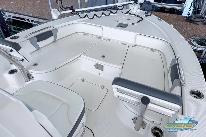 Slide: The Image of 2023 Robalo 226 Cayman boat interior with seating and storage compartments. - 39