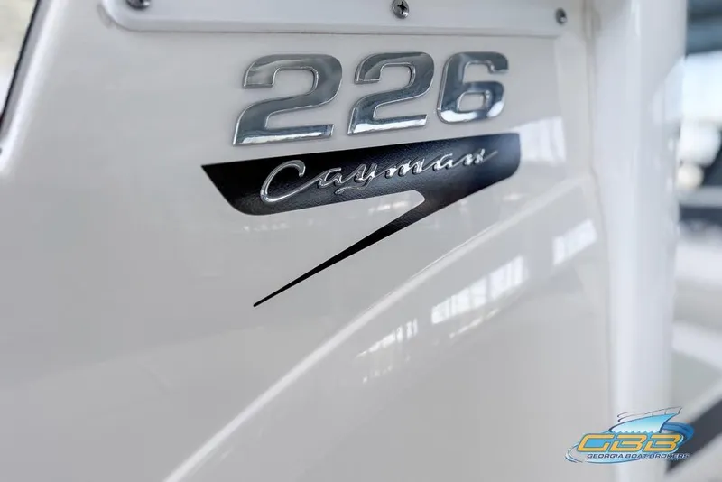 Slide: The Image of 2023 Robalo 226 Cayman boat logo detail with sleek design. - 40