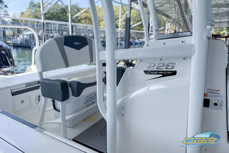 Slide: The Image of 2023 Robalo 226 Cayman boat interior with seating and console details. - 45