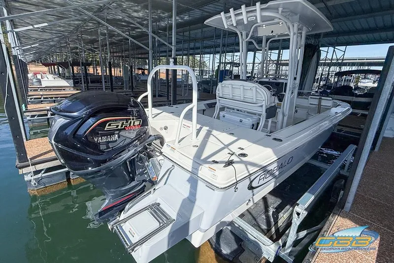 Slide: The Image of 2023 Robalo 226 Cayman boat with Yamaha engine docked in marina. - 8