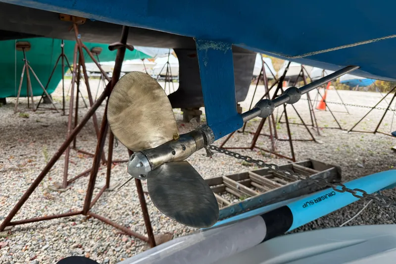 Slide: The Image of Propeller of 2006 Catalina 36 MkII sailboat on dry dock, surrounded by support stands. - 18