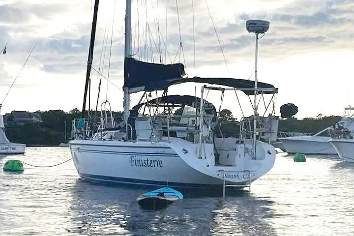 Slide: The Image of Catalina 36 MkII sailboat, 2006 model, anchored on calm water at sunset. - 2