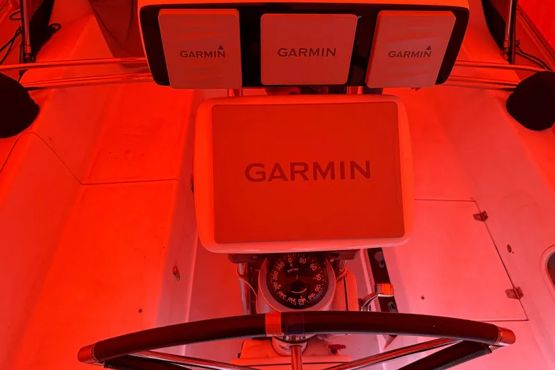 Slide: The Image of Catalina 36 MkII 2006 cockpit with Garmin navigation equipment, illuminated in red light. - 20