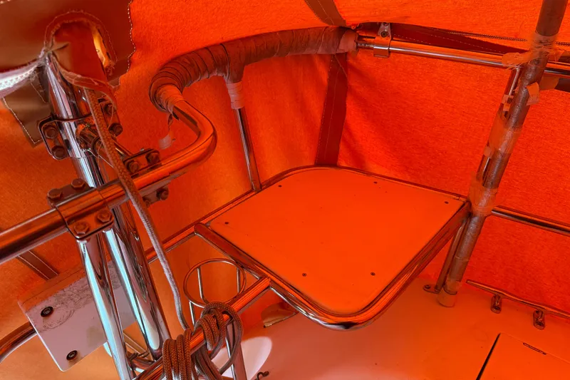 Slide: The Image of Interior view of a 2006 Catalina 36 MkII sailboat with orange canopy and metal fittings. - 30