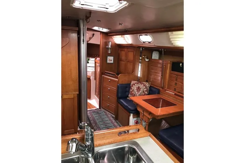 Slide: The Image of Interior of 2006 Catalina 36 MkII sailboat with wood finish and cozy seating area. - 37