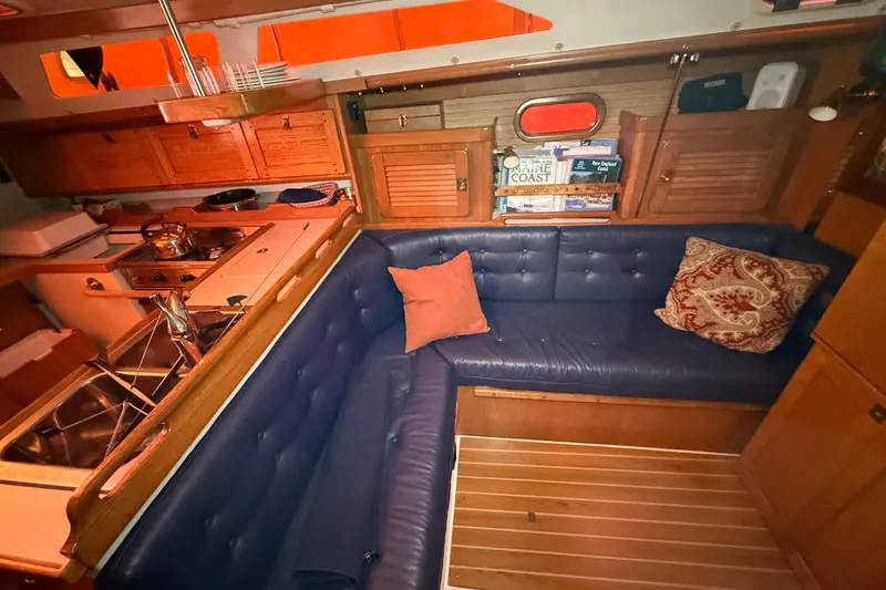 Slide: The Image of Interior of 2006 Catalina 36 MkII sailboat with cozy seating and wooden cabinetry. - 38