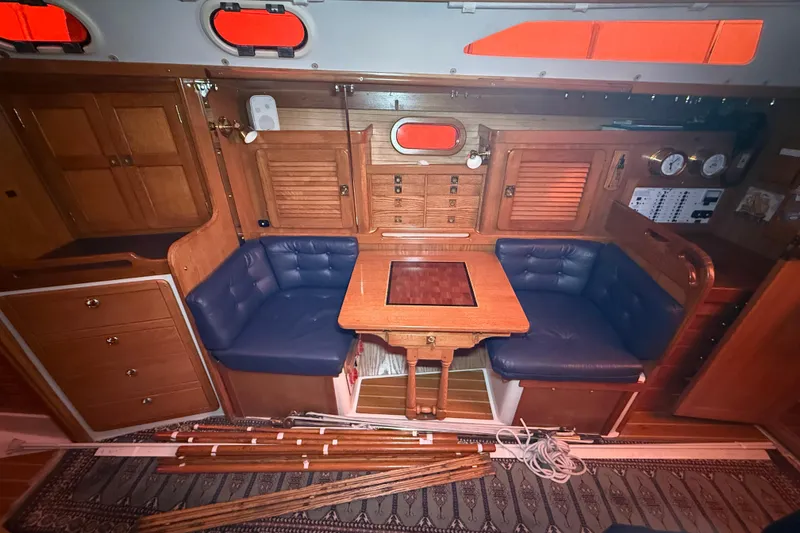 Slide: The Image of Interior of 2006 Catalina 36 MkII sailboat with wood finish and blue seating. - 43